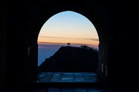 Pavilion in sihouette on the summit of Taishan, Chinaの写真素材