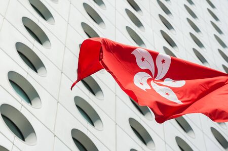 Hong Kong flag flying outside Jardine House, Central District, Hong Kongの写真素材