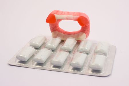Ten mint dragee packed and jaw, over white background