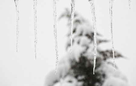 line icicles on the roof at cloudy day  の写真素材