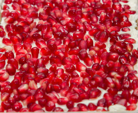 Pomegranate red seeds background in saladの写真素材