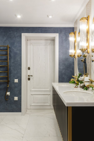 Modern bathroom with large mirrorの写真素材