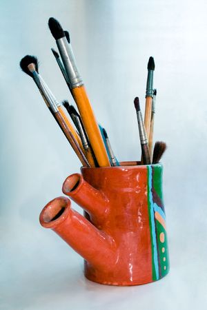 Art brushes in handmade vaseの写真素材