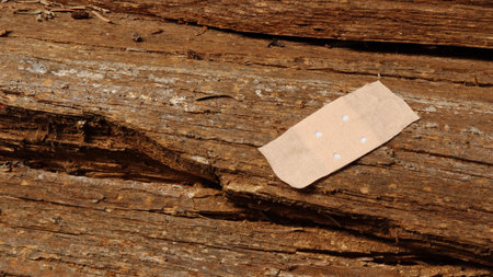 Abandoned patch on a wooden background. Selective focus.の写真素材