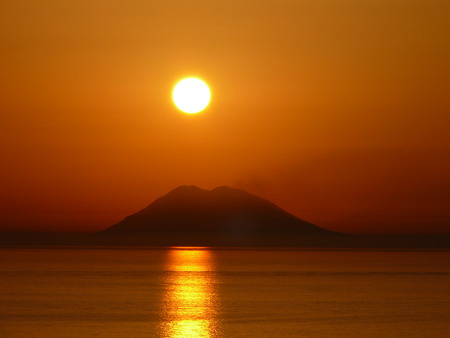 Sunset over the Stromboli, Volcano Stromboli in the evening time