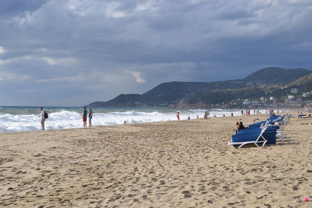 Alanya Turkey october 25, 2018: cloudy day in Cleopatra beach, people watching the seaのeditorial素材
