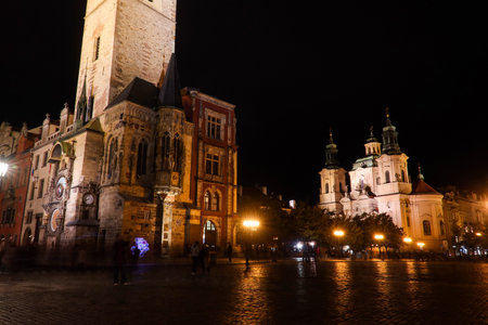 Nighttime Panorama of Old Town Square in Prague Featuring the Old Town Hall Tower and Church of St. Nicholasの写真素材