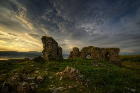 Ruins of Achadun Castle in sunset light, Isle of Lismore, Scotlandの写真素材