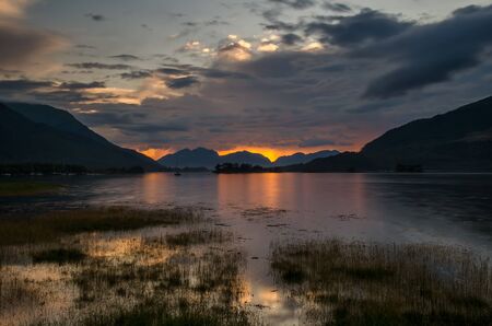 Loch Leven in Glencoe with colorful sunset in background, Highland, Scotlandの写真素材