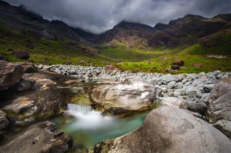 Coruisk River among cloudy Black Cuillins mountains, Isle of Skye, Scotlandの写真素材