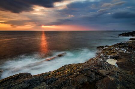 Rocky cliffs of Ardnamurchan Point in colorful sunset, Highlands, Scotlandの写真素材
