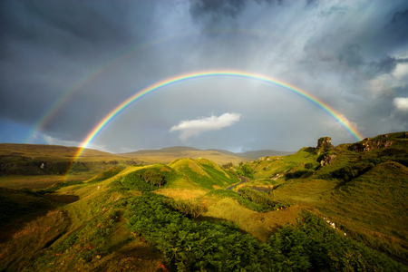 Rainbow over Fairy Glen hills, Isle of Skye, Scotlandの写真素材
