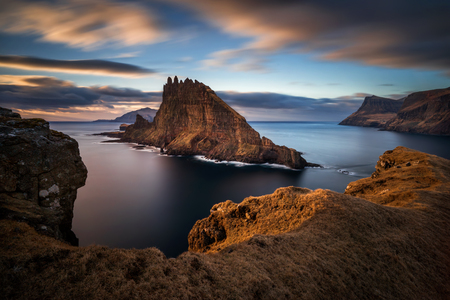 Tindholmur island next to Vagar island in sunset, Faroe Islandsの写真素材