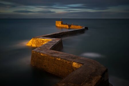 Zig zag pier in St. Monans harbour, east coast of Scotlandの写真素材