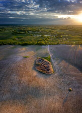 Fields of Mazury in sunset light from drone, Polandの写真素材