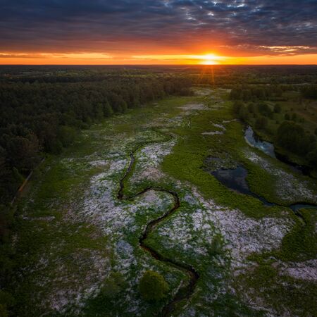 Aerial view of meandering Wymakracz river in sunset light, Polandの写真素材