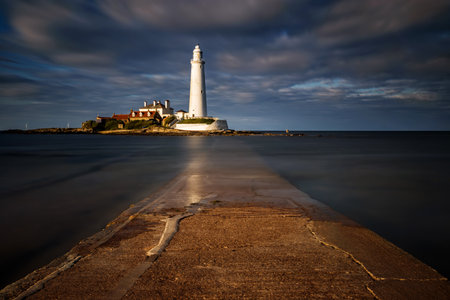 St. Mary's Lighthouse and pier in sunset, Great Britainの写真素材