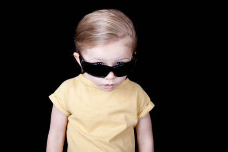 A girl that looks astonished at what the viewer has said or at what the viewer is doing?の写真素材