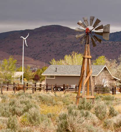 The old windmill and the new windmill stand sige by side.の写真素材
