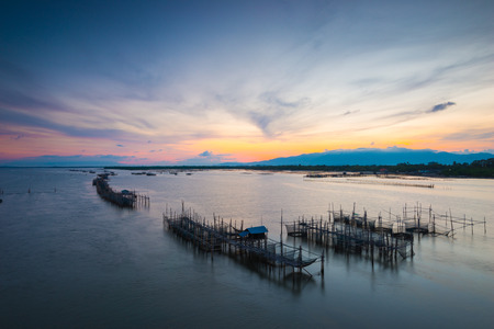 Thai's traditional fish baskets and morning landscape view from the bridge Taksin Maharat Bridge in Chonburi province, Thailand.の写真素材