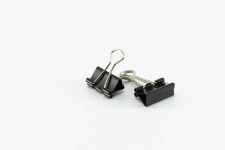 Black paper clip isolated on white background.の写真素材