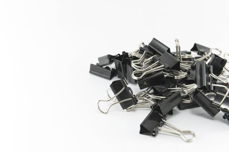 Black paper clips isolated on white background.の写真素材