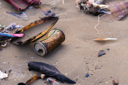 Beach pollution. Plastic bottles and other trash on sea beachの写真素材