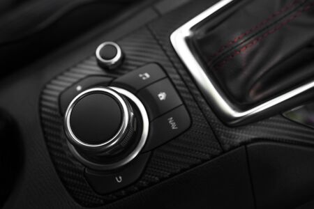 Detail of Multi function buttons and audio buttons in a modern carの写真素材