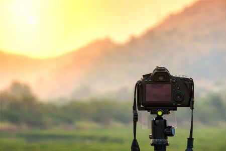 DSLR camera focus on sunrise landscape view.の写真素材