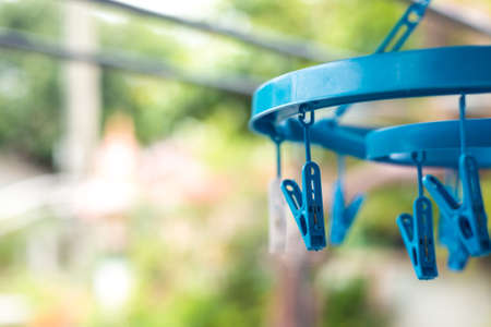 Plastic clothes pegs in blur backgroundの写真素材