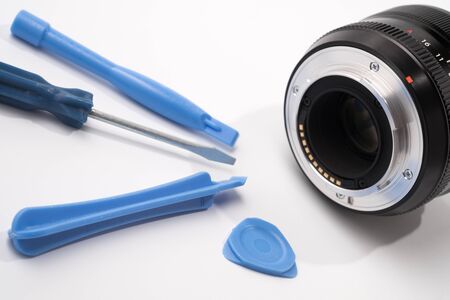 Dslr lens repair concept. isolated on white backgroundの写真素材
