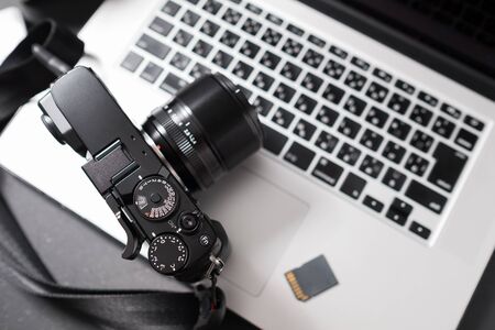 Photographer concept, Digital camera on laptop in studioの写真素材