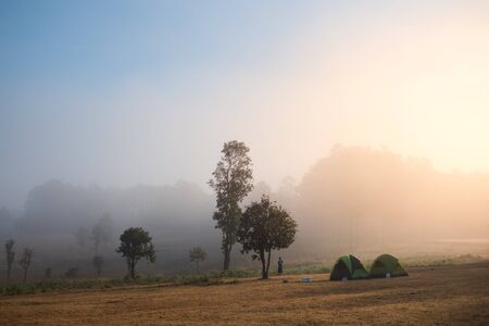 Camping scene in national park in morning with mist in winter.の写真素材