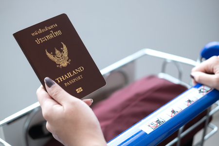 Thai passport on traveler handの写真素材