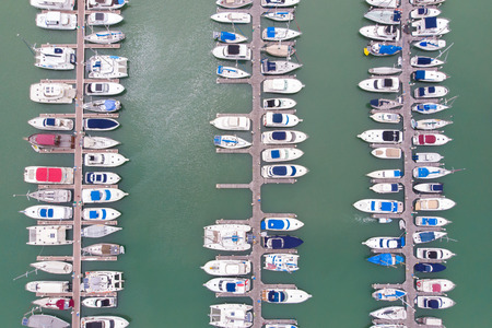 Top view of pier, Many speedboats and yachts in pier. Captured by droneの写真素材