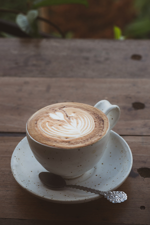 Cup coffee for Breakfast on table. Added vintage tone.の写真素材