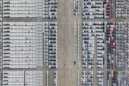 Top view of row new cars in logistic port export terminalの写真素材
