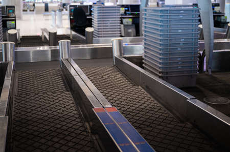 Empty airport check-in counter while coronavirus pandemic and countries lockdown, flight cancellation, bankruptのeditorial素材