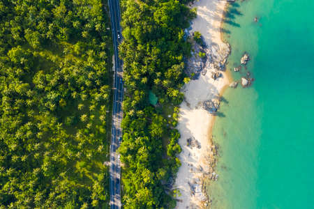 High angle view of  road pass through coconut tree forest and beautiful coastline in Khanom, Nakhon si thammarat, Thailandの写真素材