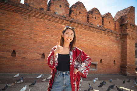 Asian woman traveling at Tha Phae Chiangmai old city wall in northern Thailandの写真素材