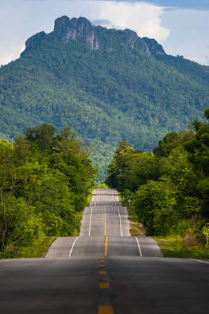 Bumpy asphalt road on hill in Lampang Thailandの写真素材