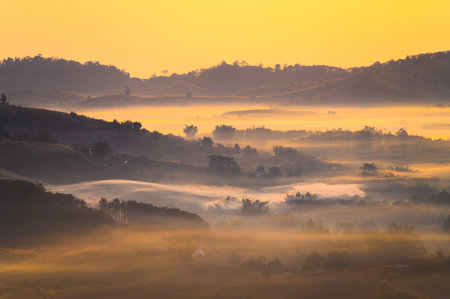 Misty landscape in morning from Wat Gong Niam viewpoint the famous viewpoint in Khao Kho hill in Phetchabun, Thailandの写真素材