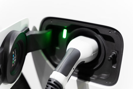Electric vehicle charging port plugging in EV modern car. save ecology alternative energy sustainable of futureの写真素材