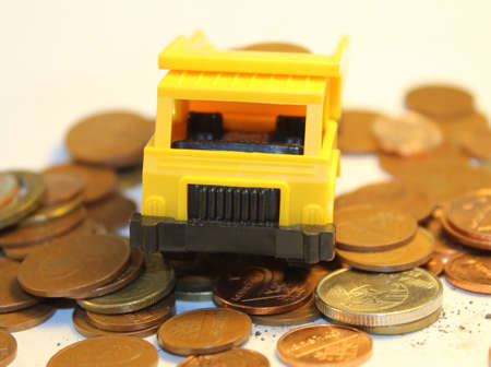 Toy dump truck with coinsの写真素材
