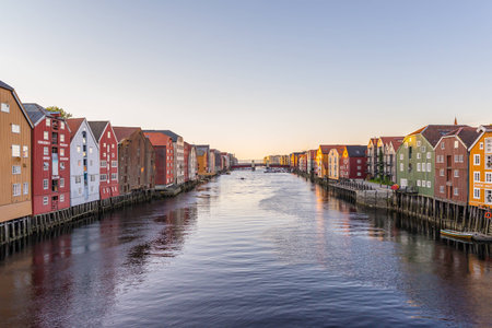 Old wooden colorful seahouses by Nidelven river in Trondheim, Norway.