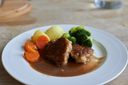 Homemade fish cakes with carrots, potatoes and broccoliの写真素材