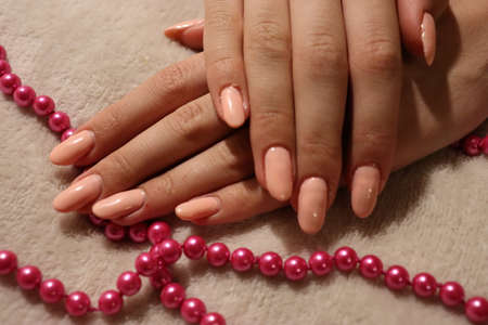 girl showing her pink manicureの写真素材