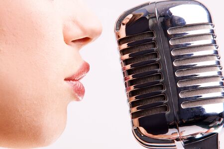 pop female singer with the retro microphone の写真素材