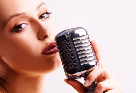 pop female singer with the retro microphone の写真素材