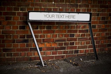 Place your text here - empty ad place at the street - brickwall background の写真素材